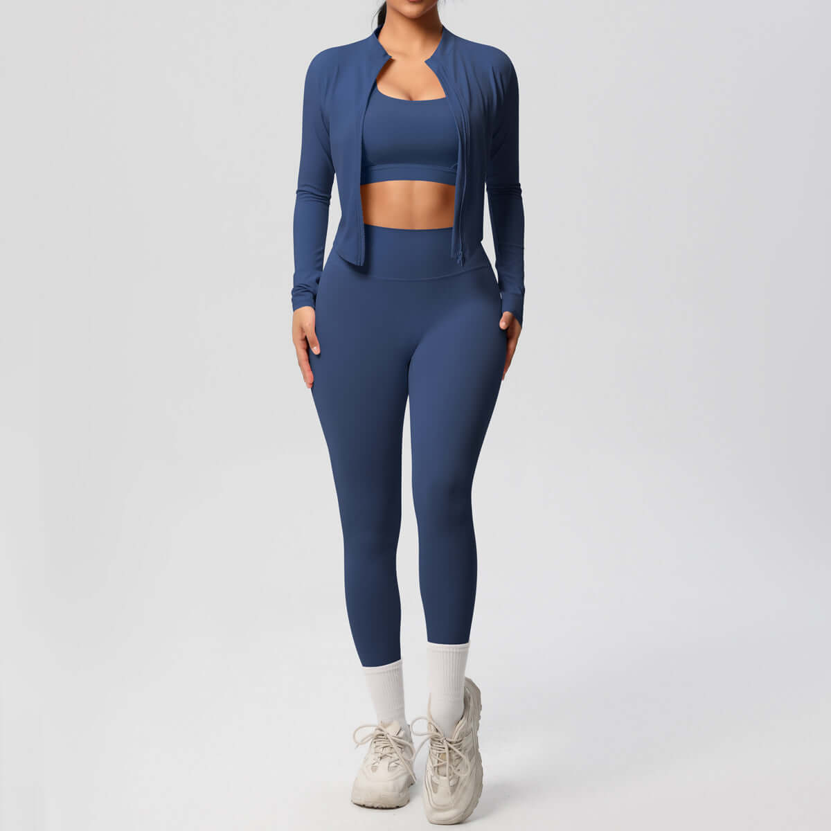 Women's yoga outfit set featuring a blue spandex coat, top, and trousers for activewear.