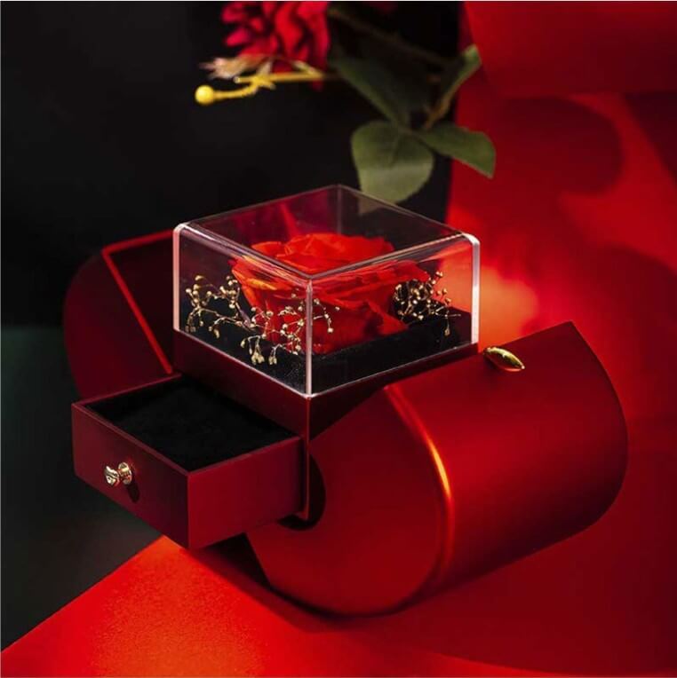 Handmade rose jewelry box with a glass top showcasing a red rose and decorative details in a unique design.