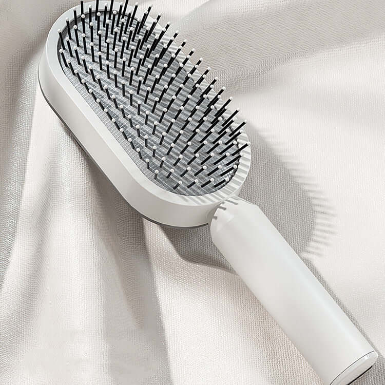 Self cleaning hairbrush with a 3D air cushion design for smooth and healthy hair care.