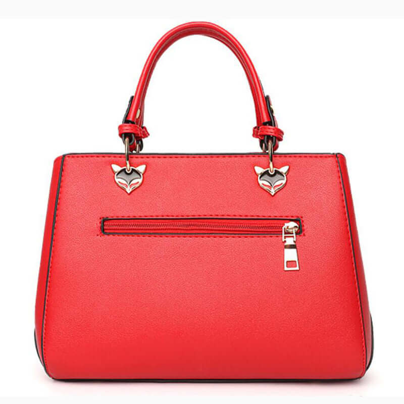 Patchwork women's shoulder bag in vibrant red with unique fox-shaped embellishments and zippered pocket.