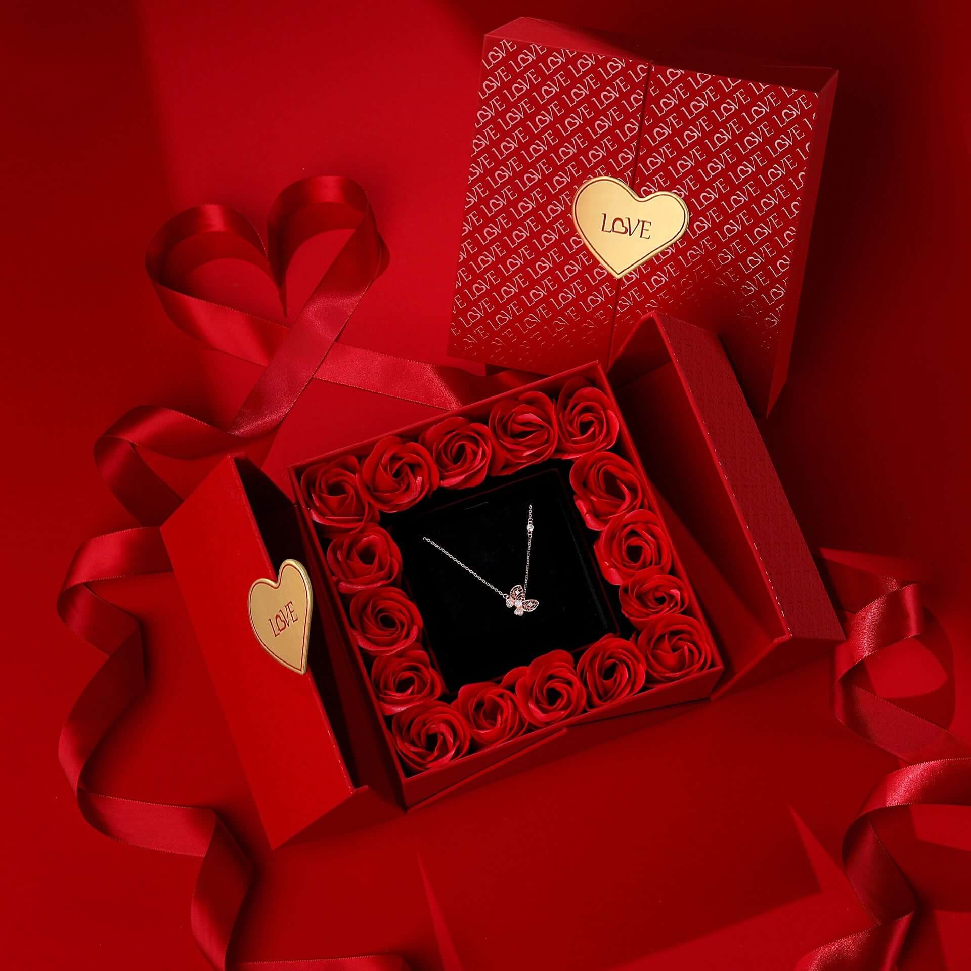 Valentine's Day romantic luxury gift box with necklace and red roses.