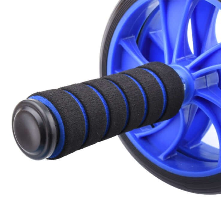 Home gym fitness equipment ab wheel handle close-up for effective core training at home.