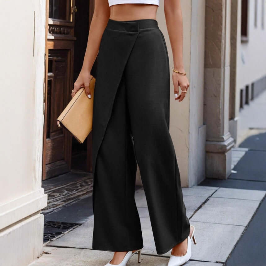 high-waist patchwork suit pants in black worn by a woman, styled with a clutch and heels, elegant fashion look.
