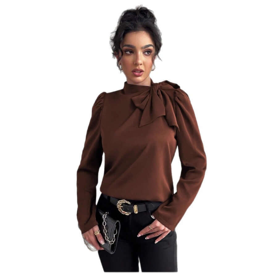 Elegant long sleeve shirt in brown with bow detail and stylish black pants.