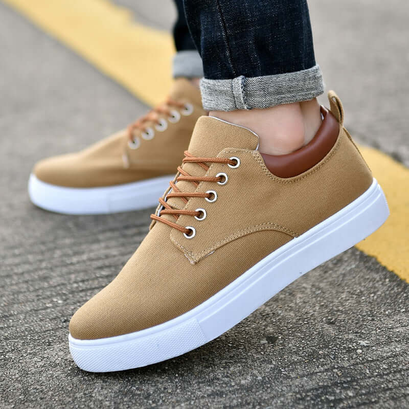 Classic canvas sneakers for men and women featured in a casual outdoor setting.