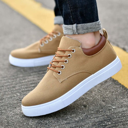 Classic canvas sneakers for men and women featured in a casual outdoor setting.