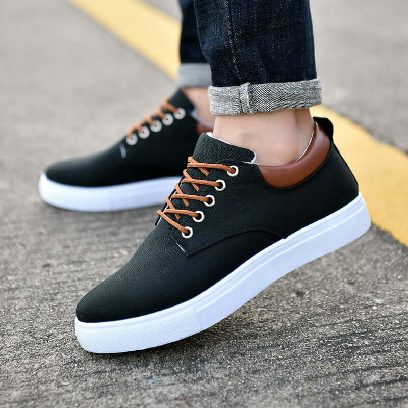 Classic canvas sneakers in black with brown accents, perfect for casual daily wear for men and women.