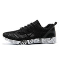 men's breathable sneakers in black mesh design with lightweight sole and stylish accents.