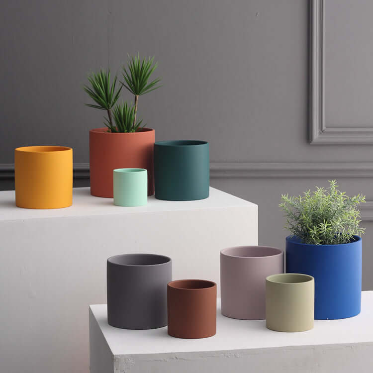 Nordic ceramic flowerpot with drainage hole displayed in various sizes and colors for indoor and outdoor plants.
