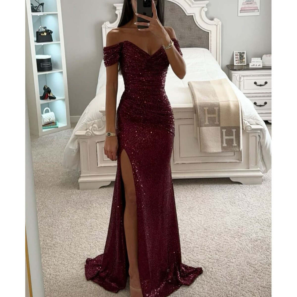 Charming slimming fashion dress in wine red color with off-shoulder design and slit, showcasing stylish and beautiful design.