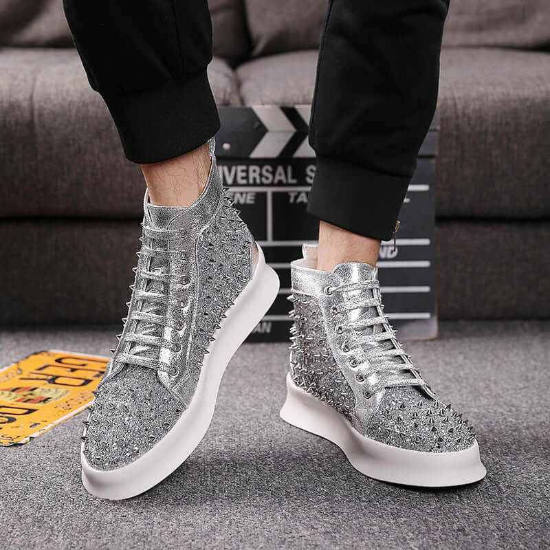 Shiny silver spiked high-top sneakers for trendy street style.