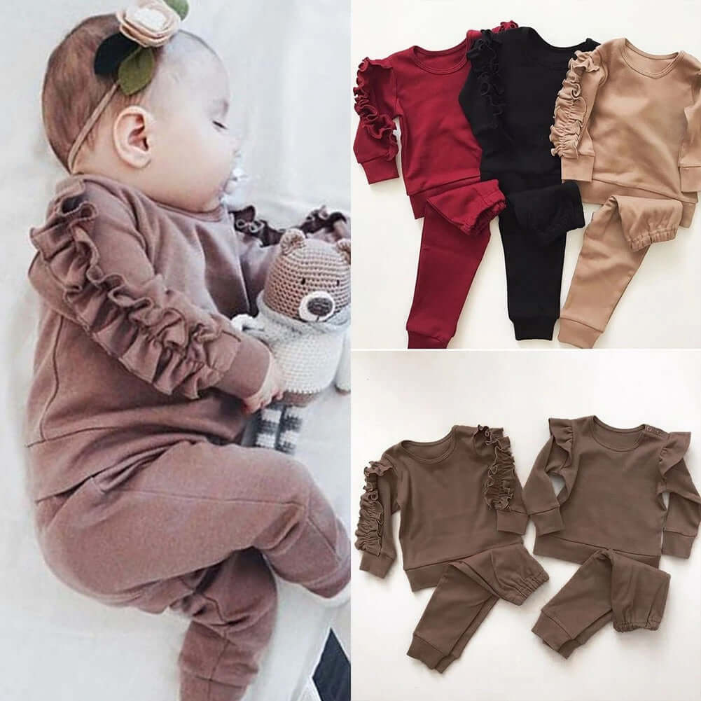 Kids ruffle sweatshirt set featuring a baby in a cozy outfit with playful ruffle details and assorted colors.