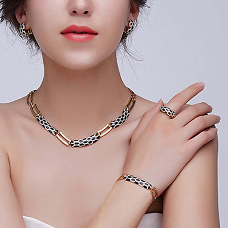 costume jewelry sets for women featuring a necklace, earrings, bracelet, and ring in elegant design.