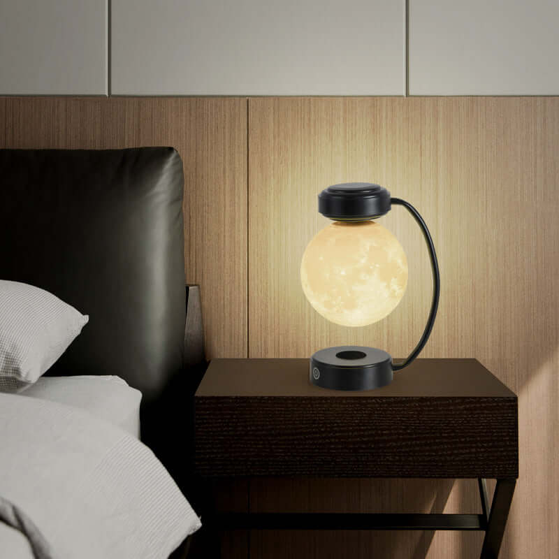 Levitating 3D moon lamp on a bedside table, casting a warm glow in a cozy bedroom setting.