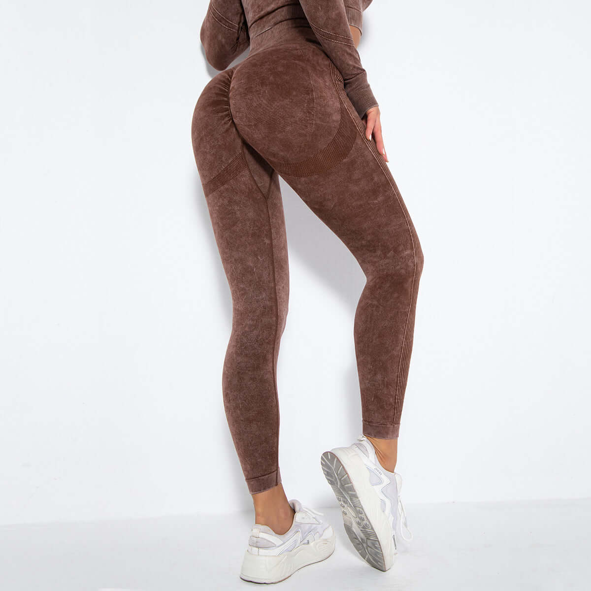 Back view of women's washed sports leggings in brown, ideal for workouts and yoga, showcasing nylon-spandex blend fabric.