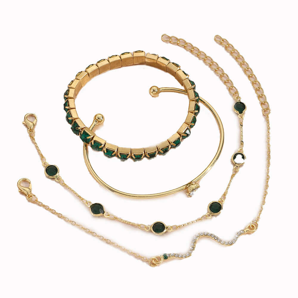 Stylish snake bracelets set featuring gold and green accents in a unique design.
