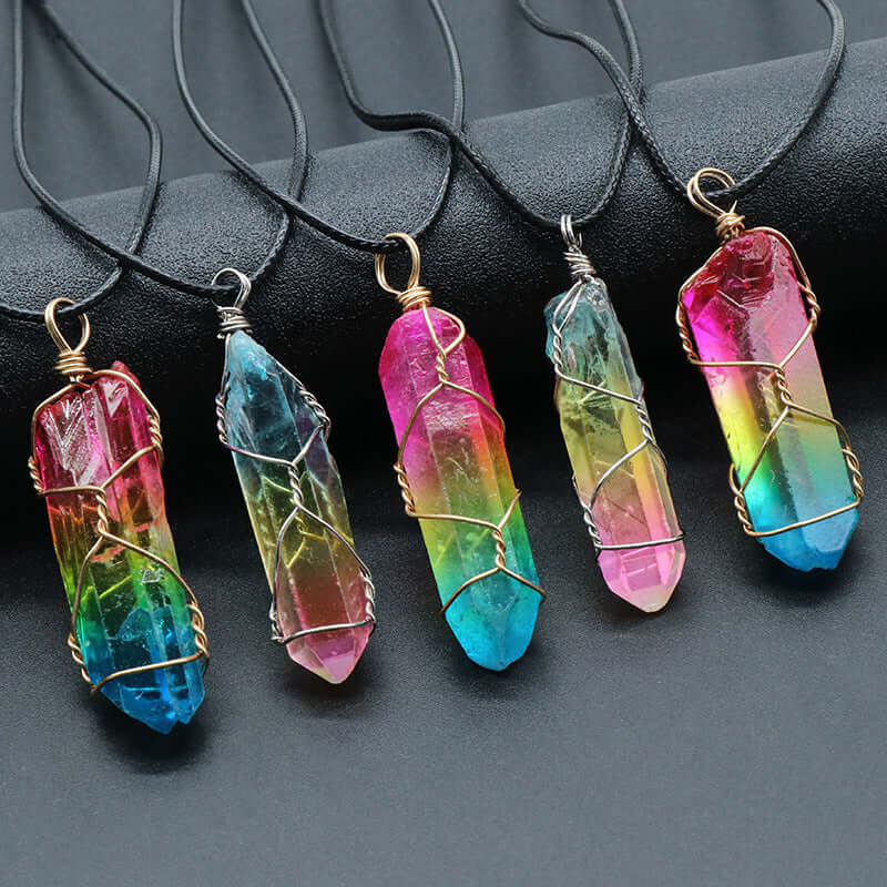 Tree of Life crystal necklace in vibrant colors, featuring wire-wrapped stone crystals on black cords.