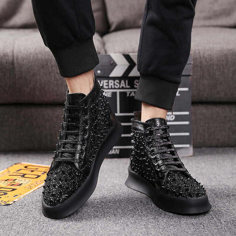 Men's fashionable spiked black sneakers with lace-up design for stylish casual wear.