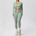 Women's yoga outfit set featuring a spandex activewear coat, top, and trousers in a stylish green design.
