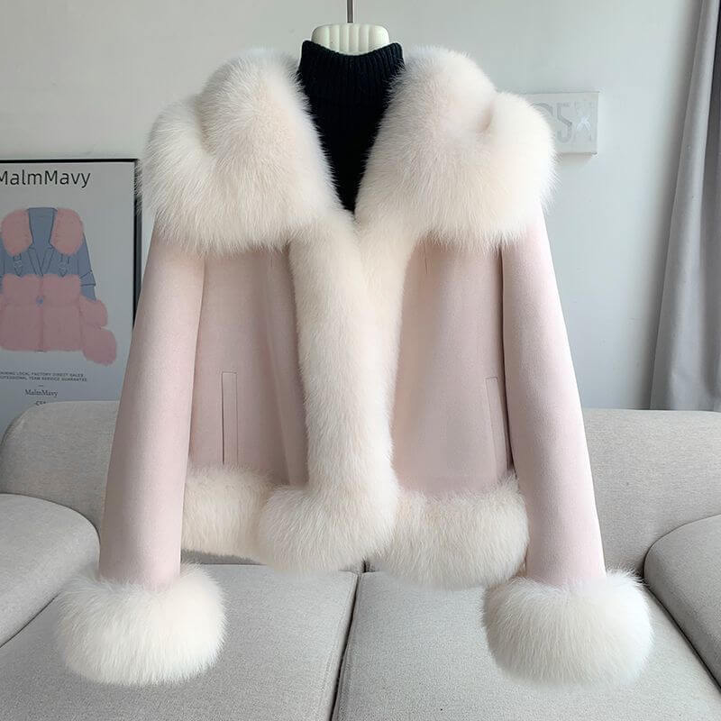 Stylish winter fur coat for women in blush pink with luxurious fur trim and A-line silhouette.