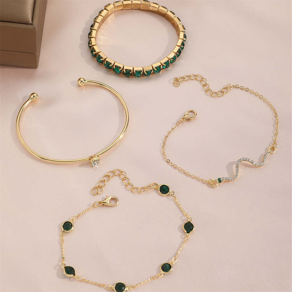 Stylish snake bracelets featuring unique designs, elegant materials, and various colors in a set of four.