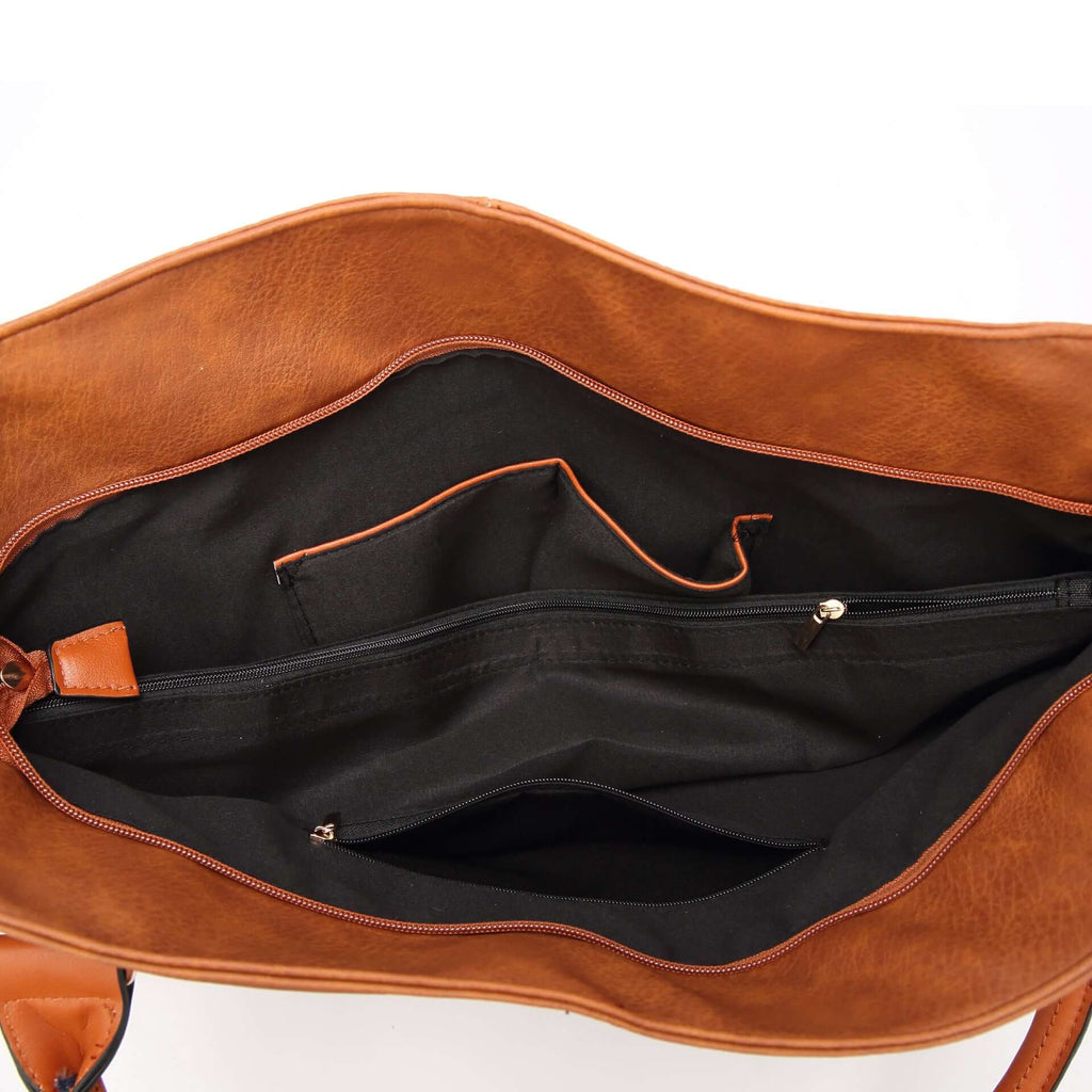 Interior view of a bold statement handbag for women showcasing spacious compartments and stylish design.