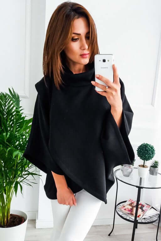 comfortable everyday sweatshirt for women, featured in a casual setting with plants and minimalist decor.