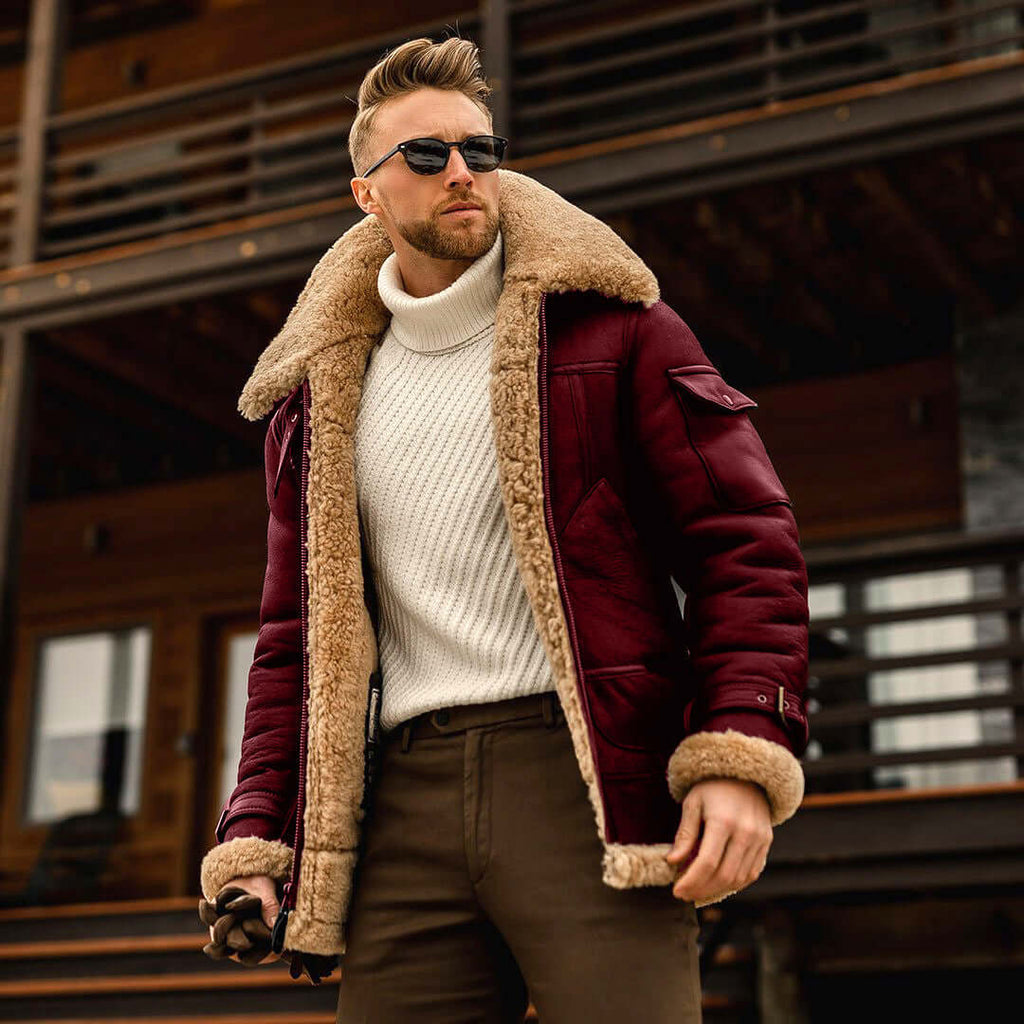 Man wearing a warm padded winter jacket with a fur collar and sunglasses, perfect for outdoor winter activities.