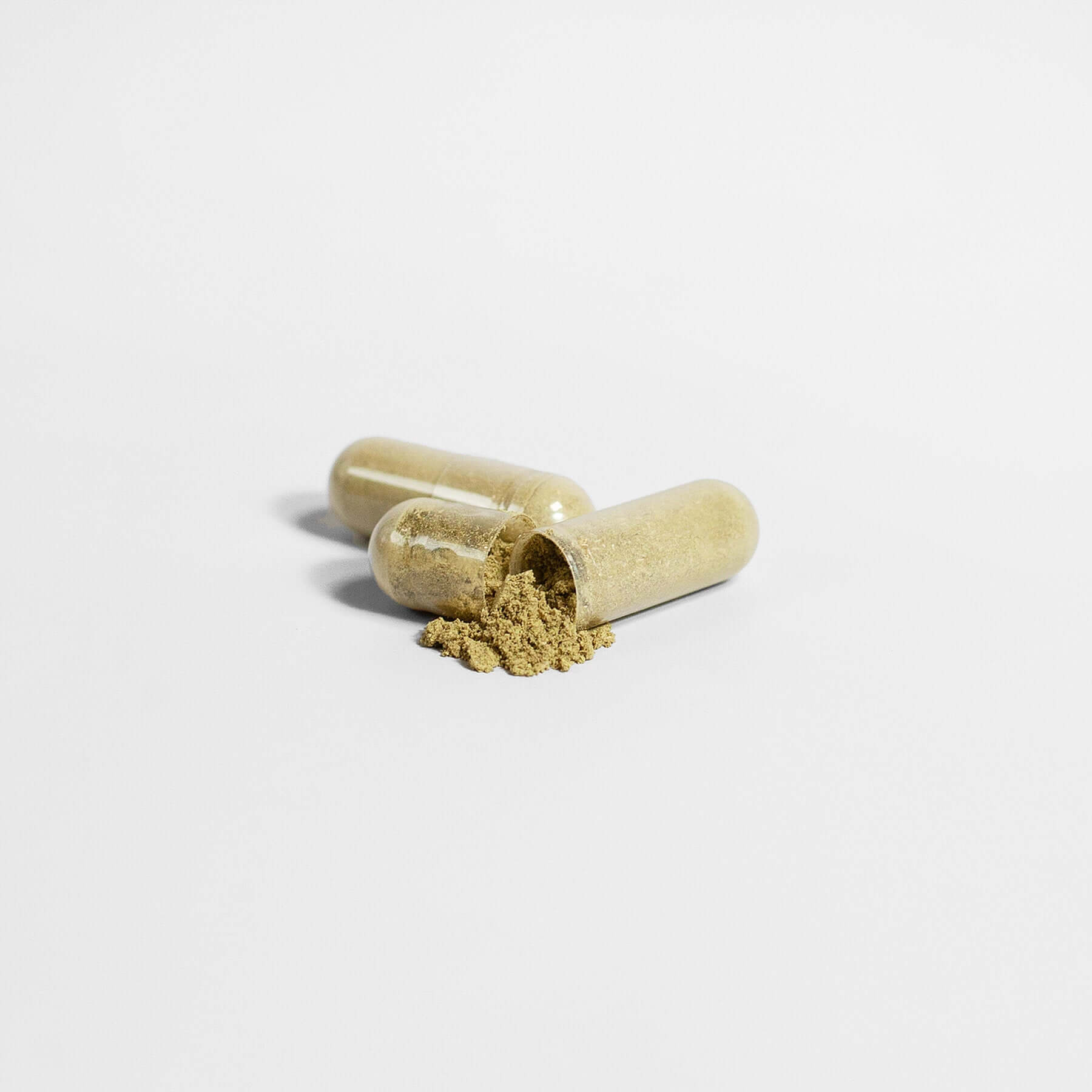 Moringa nutrient supplement capsules with powder spilled, perfect for energy, immune support, and overall wellness.
