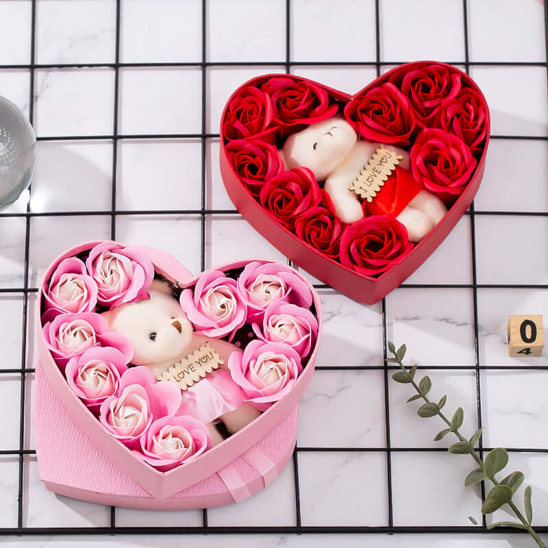 Romantic heart gift box featuring a teddy bear and roses in a heart-shaped arrangement.