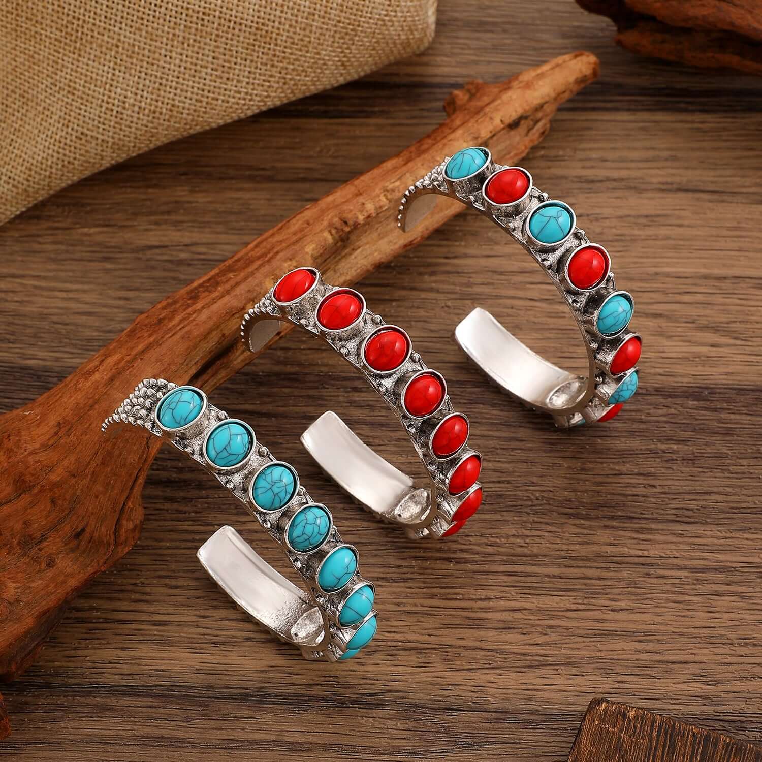 Ring-shaped electroplated bracelet showcasing red and blue stones, perfect bold statement jewelry for women.