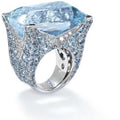 Stunning blue square ring for women adorned with sparkling artificial gems and a large blue stone.
