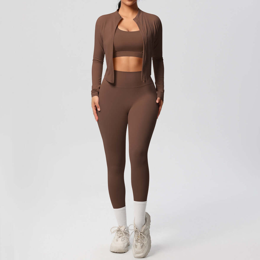 Women wearing a brown women's yoga outfit set including a spandex coat, top, and trousers, perfect for yoga and gym.
