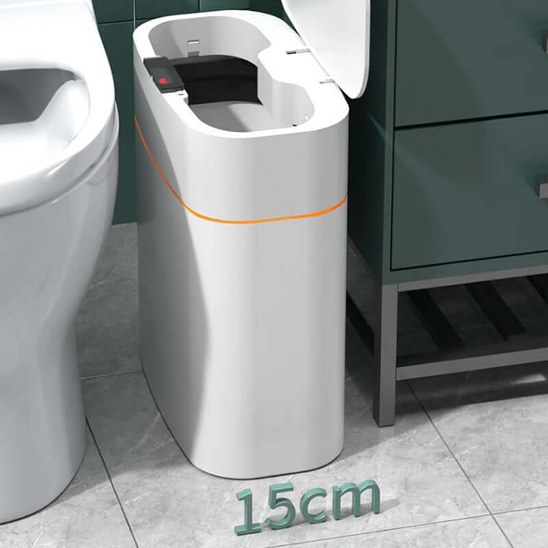 Smart motion sensor trash bin next to a bathroom toilet, showcasing its sleek design and compact 15cm size.