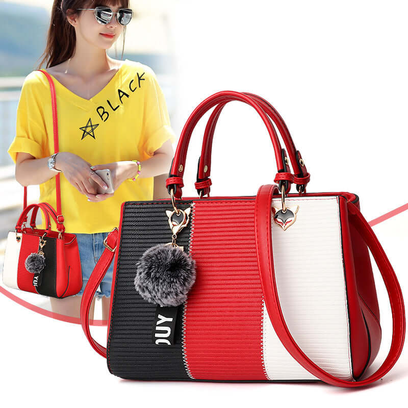 Patchwork women's shoulder bag in red, black, and white with pom-pom detail, perfect for stylish daily use.