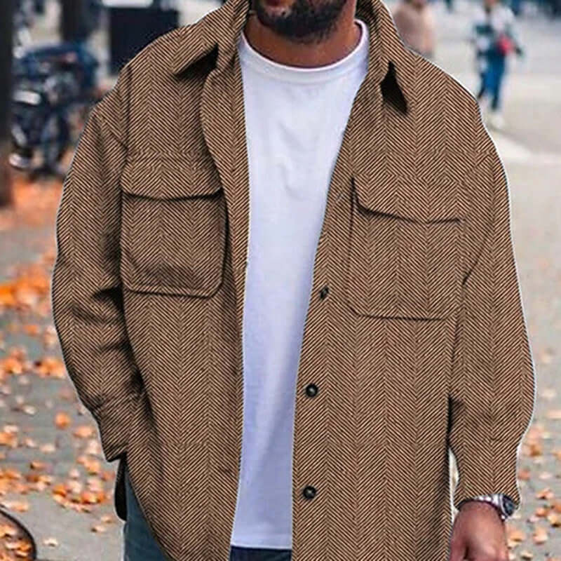 men's polo collar work coat in brown herringbone pattern, worn by a man outdoors in autumn.