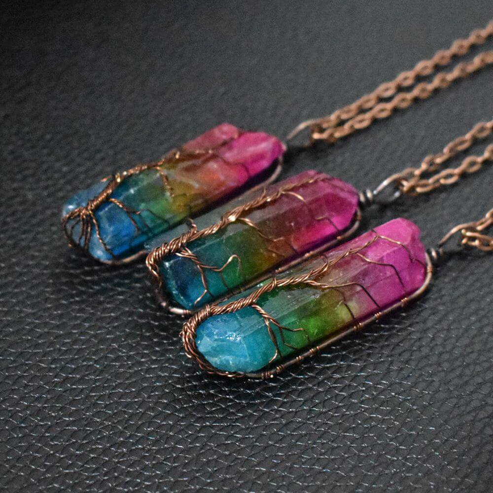 Tree of Life crystal necklace featuring colorful stone crystals wrapped in copper wire.