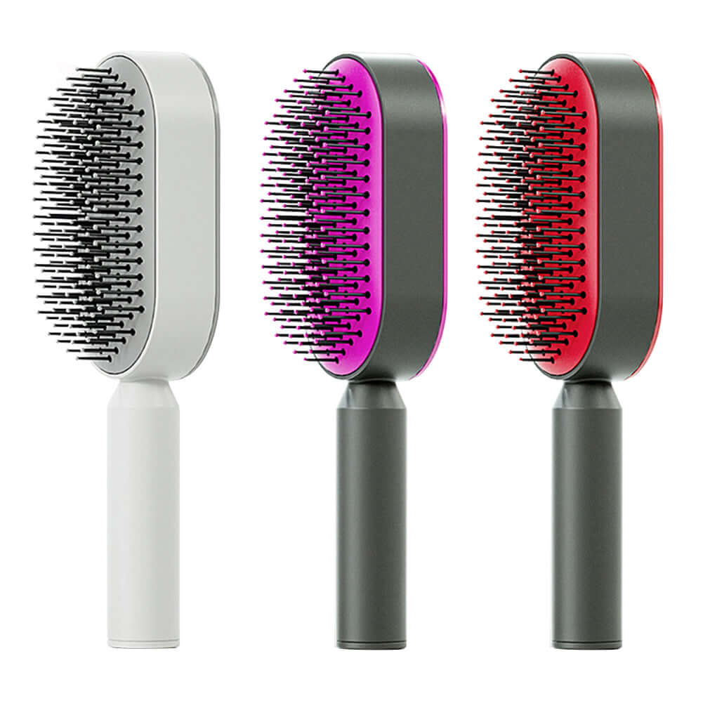 Self cleaning hairbrush set in three colors: white, pink, and red with ergonomic design for easy brushing.