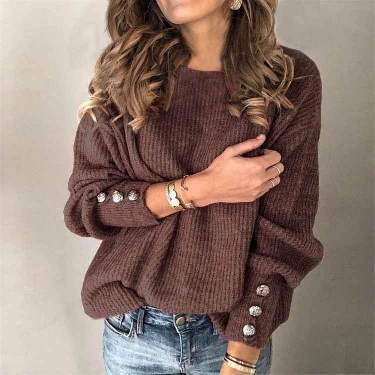 Long sleeve round neck t-shirt in a brown knitted style worn by a woman with loose fitting and button details.