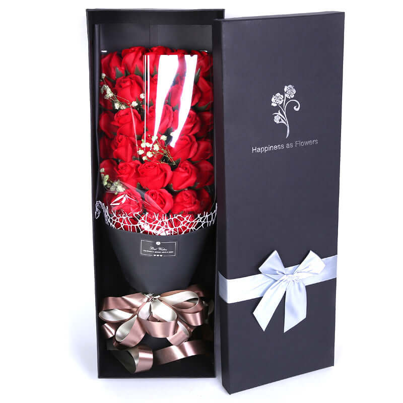 Luxury floral gift bouquet in elegant black box with red roses and decorative ribbon.