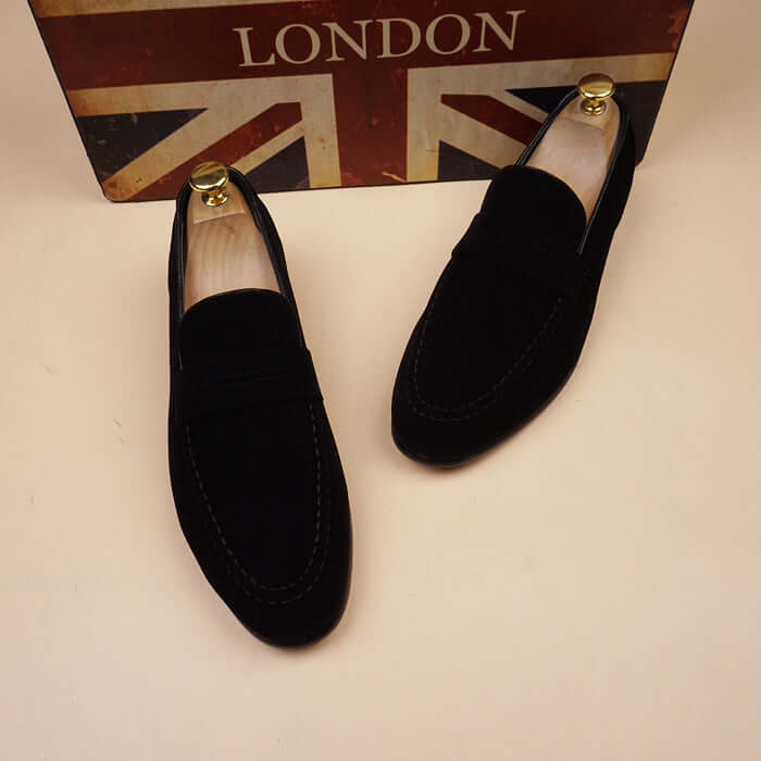 premium men's leather shoes displayed on a background featuring the Union Jack flag.