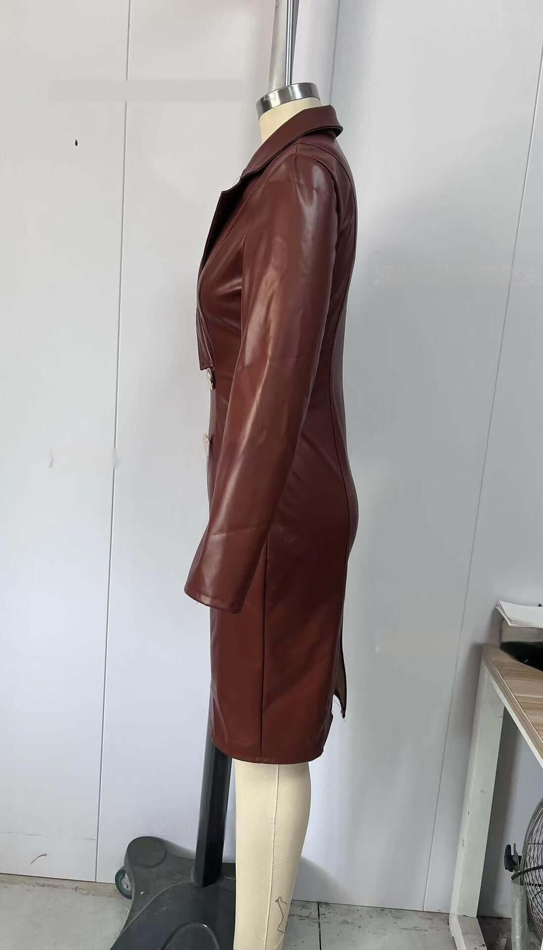 Side view of a red-brown PU leather coat dress on a mannequin showcasing its elegant mid-rise design.