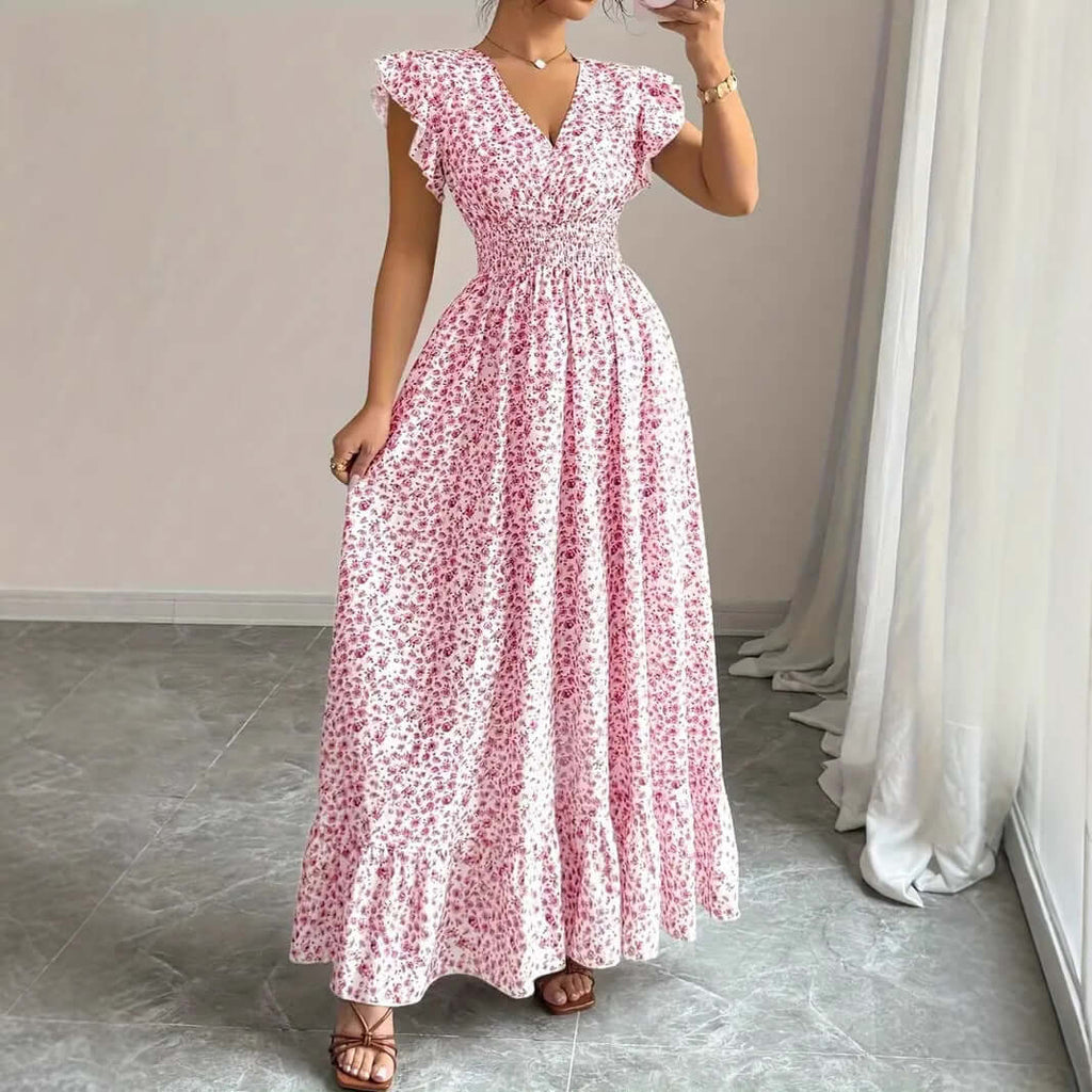 Women's floral summer dress featuring ruffle sleeves and a pink floral pattern, perfect for casual outings.