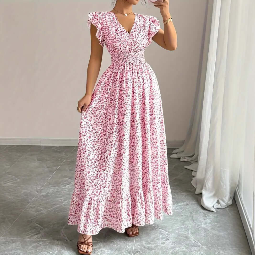 Women's floral summer dress featuring ruffle sleeves and a pink floral pattern, perfect for casual outings.