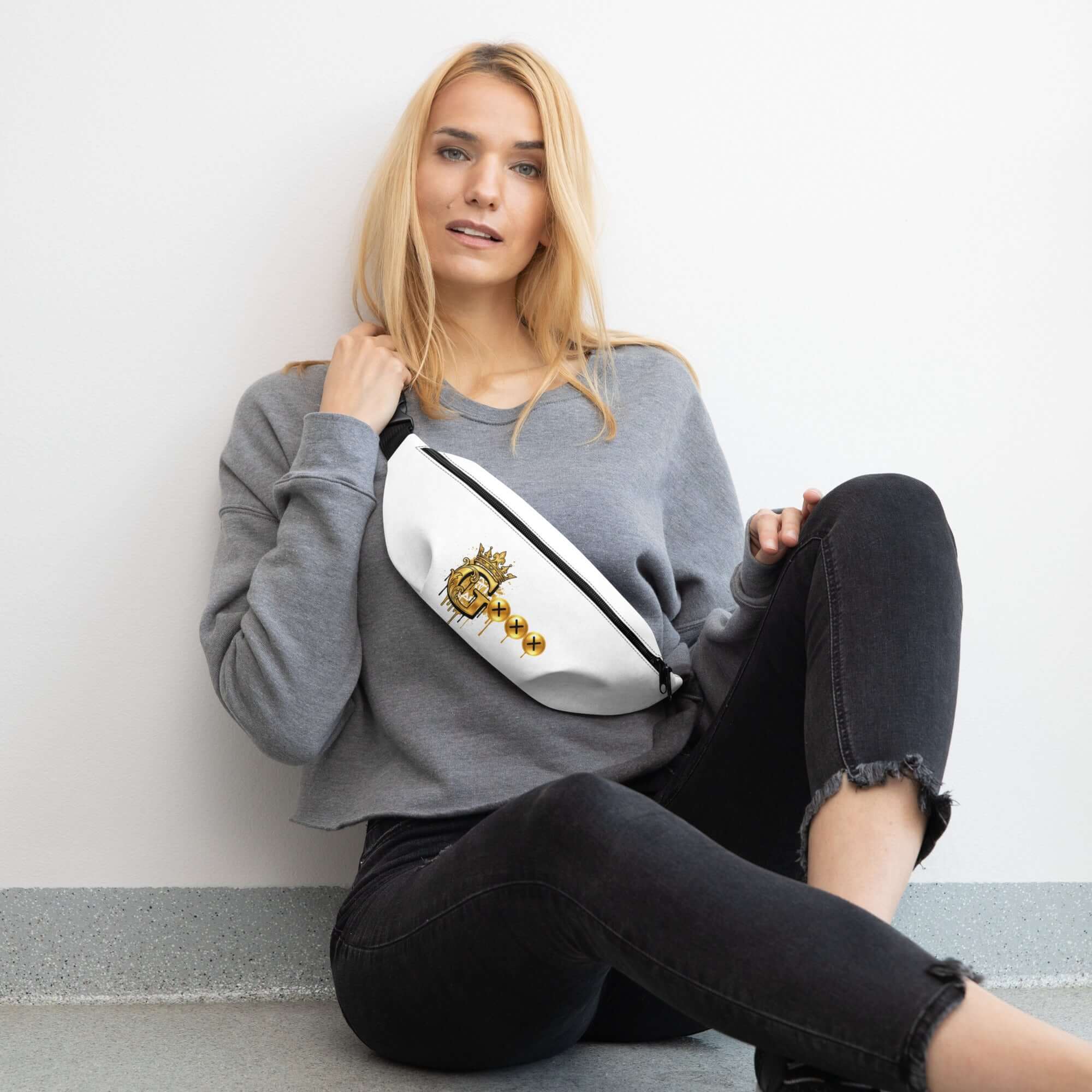 Stylish fanny pack for travel worn by a woman in casual outfit, sitting on the floor.