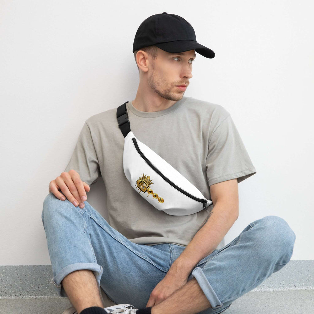 Stylish fanny pack for travel worn by a man sitting casually on the floor, showcasing its sleek design.