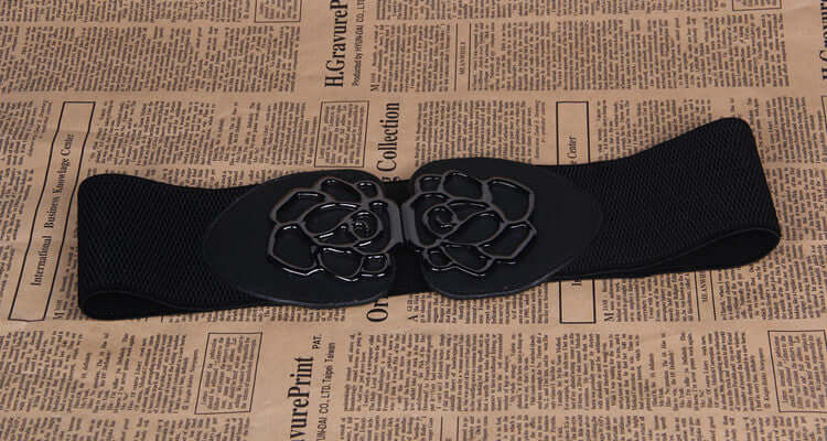Slim women's waist belt featuring a floral buckle design, suitable for dresses and outfits.