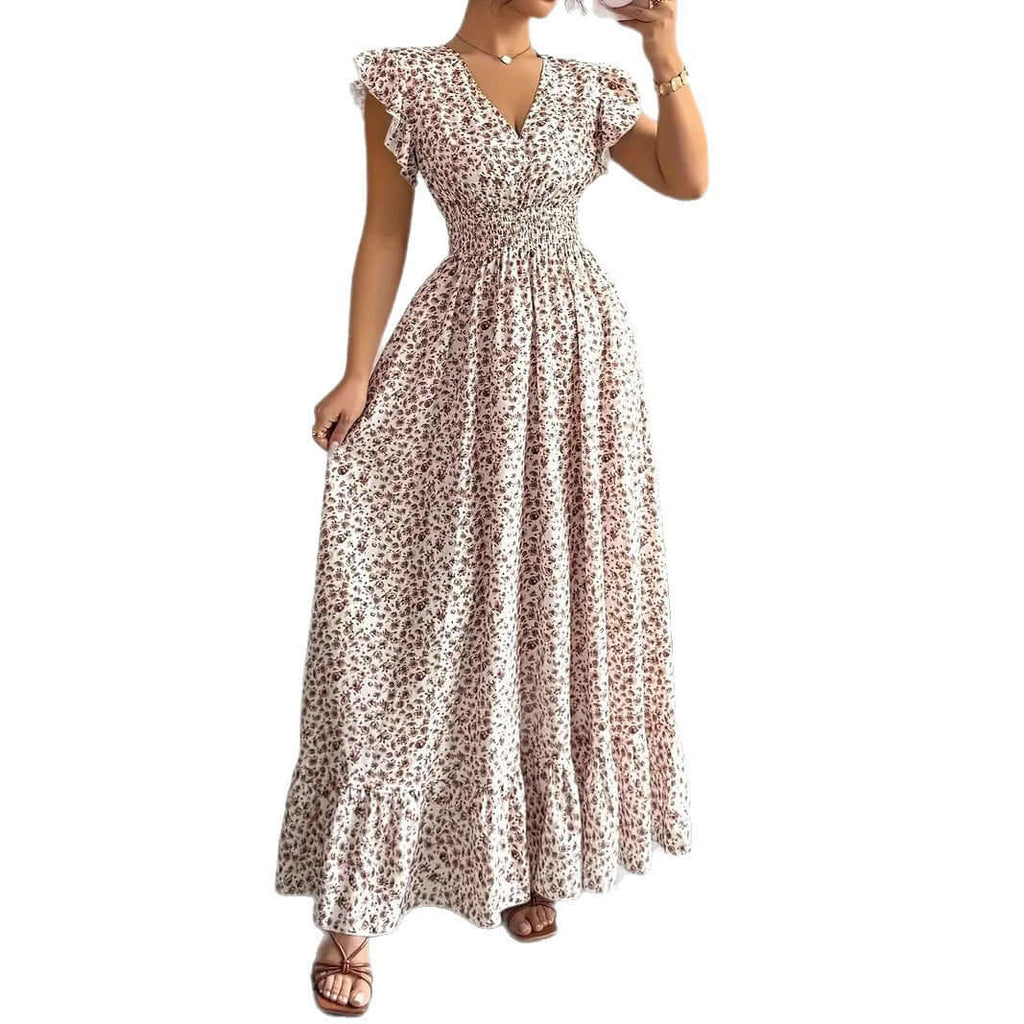 Women's floral summer dress with ruffle sleeves in a breezy maxi style and floral print.