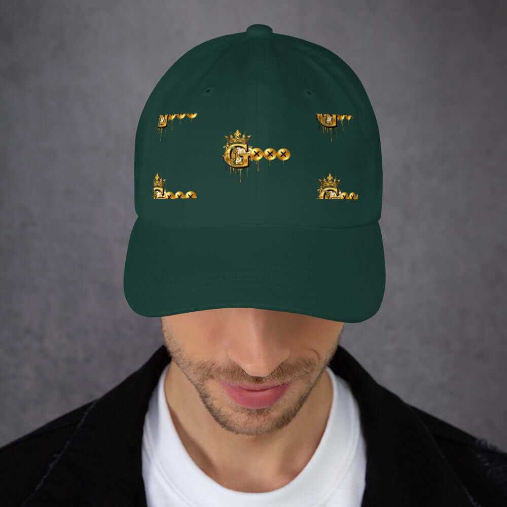 Low profile dad hat in green with gold graphic designs, adjustable strap, and curved visor for casual style.