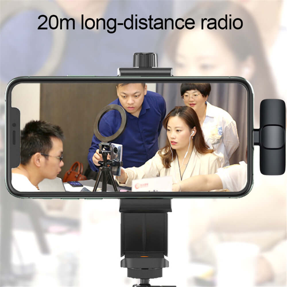 Wireless clip-on microphone with noise reduction being used in a group setting for interviews and live broadcasts.